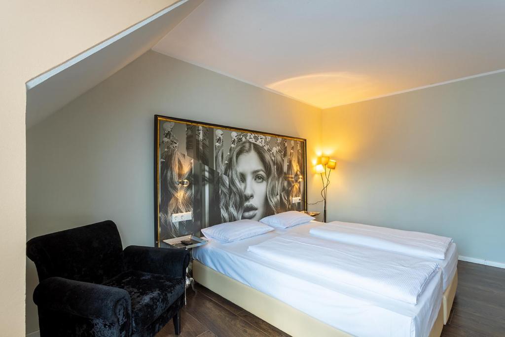 Postel nebo postele na pokoji v ubytování Hotel Calmo