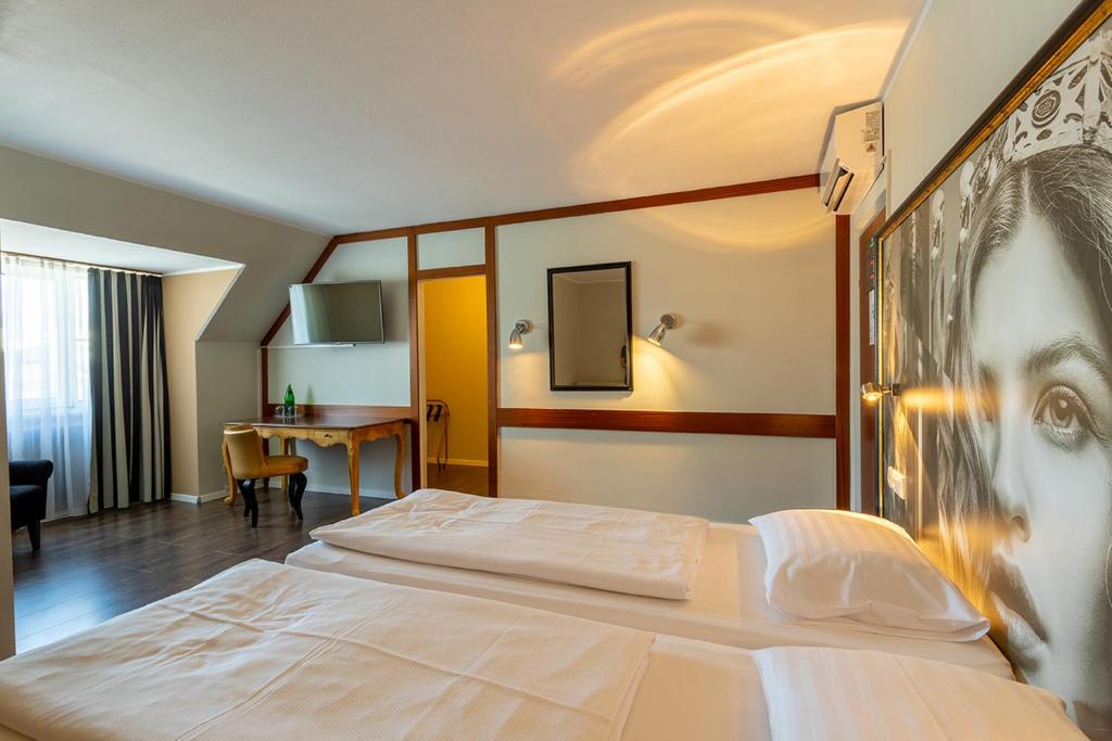 Postel nebo postele na pokoji v ubytování Hotel Calmo