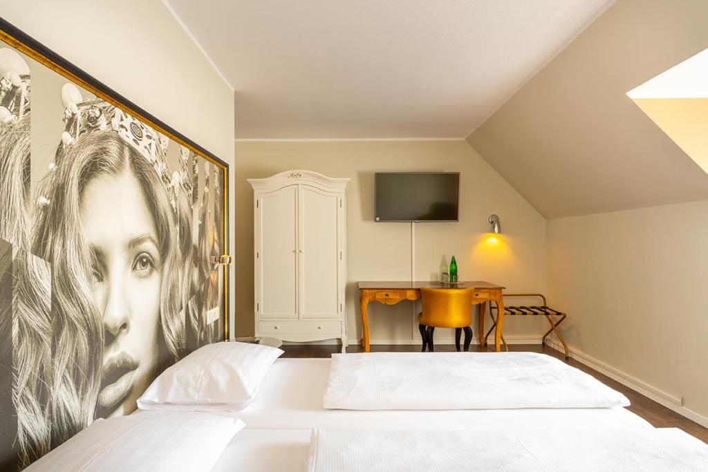 Postel nebo postele na pokoji v ubytování Hotel Calmo