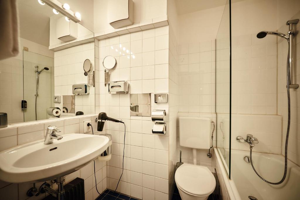 Koupelna v ubytování Hotel Calmo