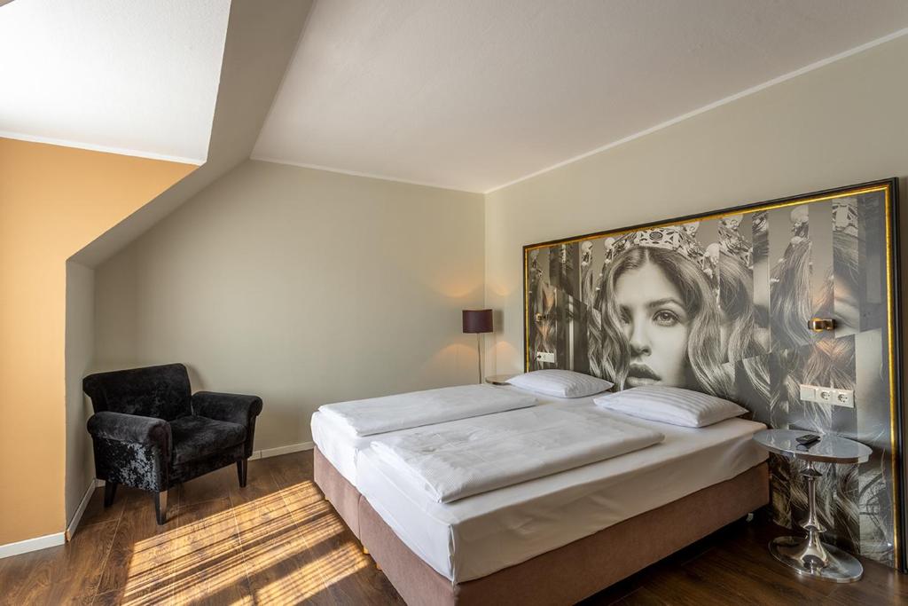 Postel nebo postele na pokoji v ubytování Hotel Calmo