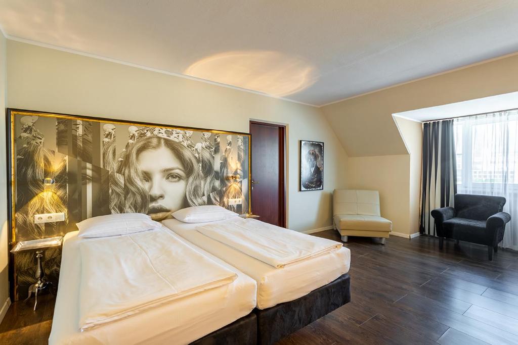 Postel nebo postele na pokoji v ubytování Hotel Calmo