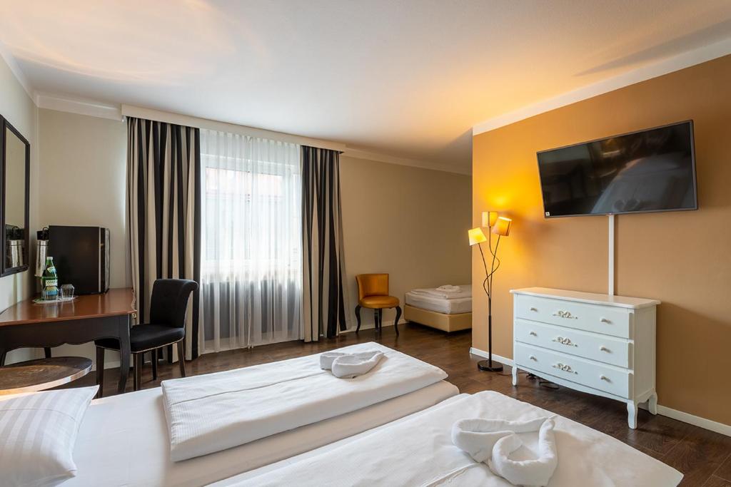 Postel nebo postele na pokoji v ubytování Hotel Calmo