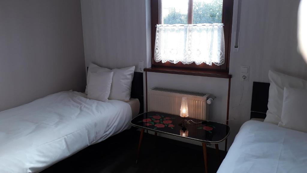 Postel nebo postele na pokoji v ubytování Villa Franzen