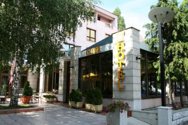 a building with a sign on the front of it at Hotel Dinara in Livno