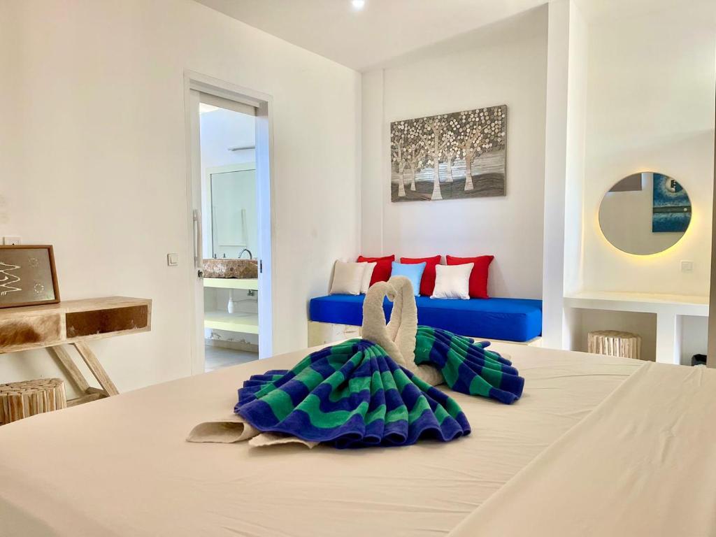 Postel nebo postele na pokoji v ubytování Cocotoa Boutique Hotel & Villa