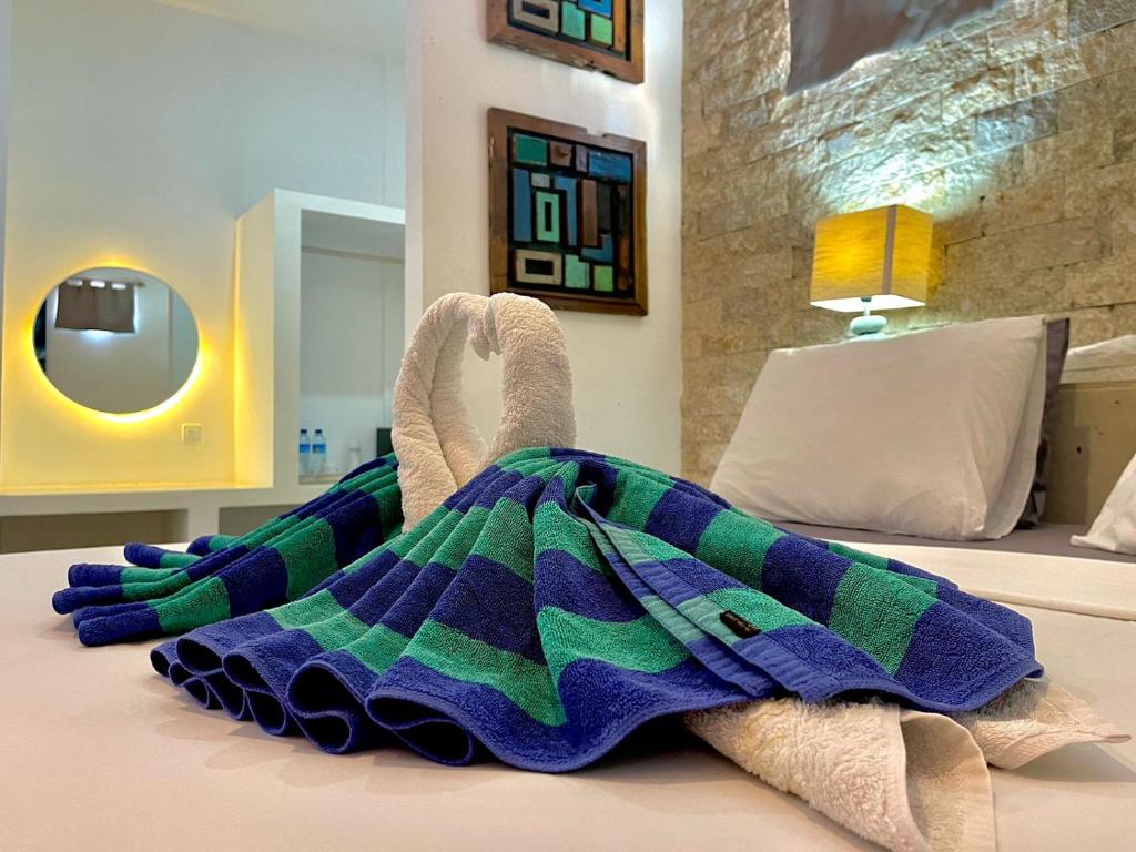 Postel nebo postele na pokoji v ubytování Cocotoa Boutique Hotel & Villa