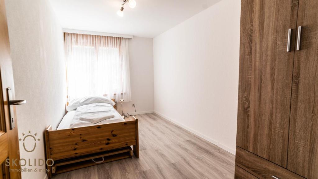 Postel nebo postele na pokoji v ubytování Gemütliches Ferienhaus Brigerbad