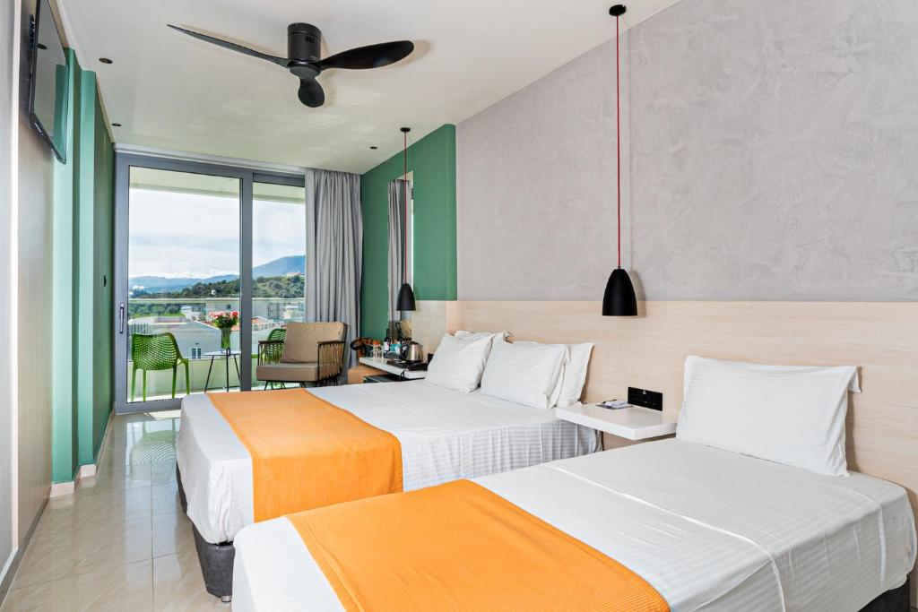 Postel nebo postele na pokoji v ubytování Corissia Princess Hotel 