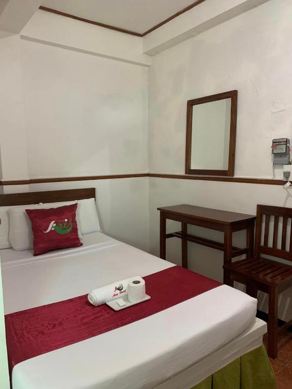 Postel nebo postele na pokoji v ubytování Axis Pension Hotel