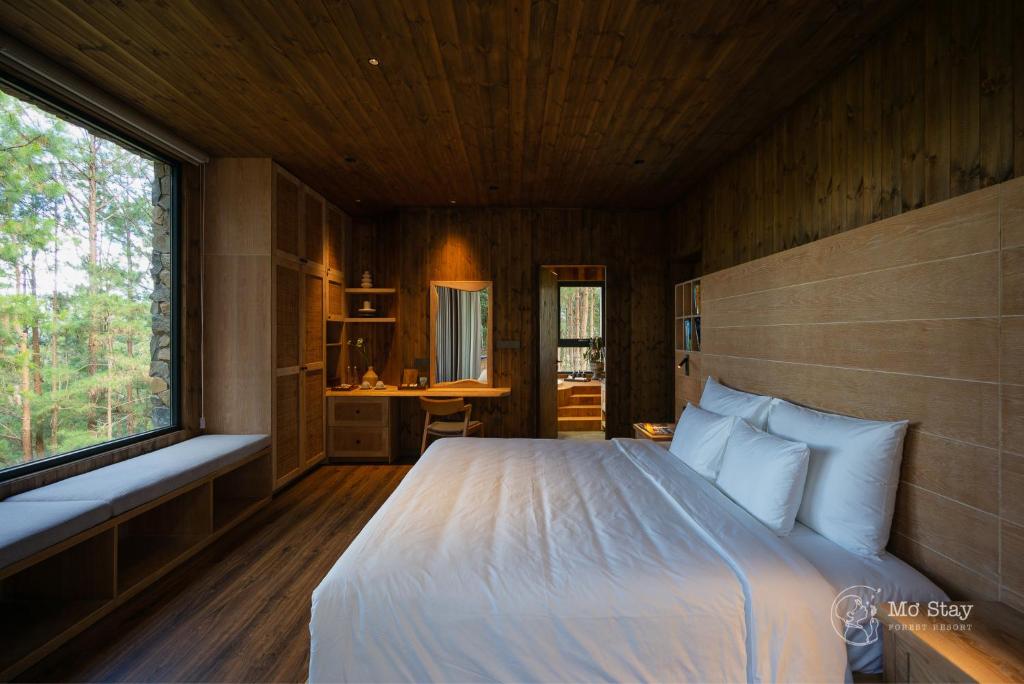 Giường trong phòng chung tại Mơ Stay - Forest Resort