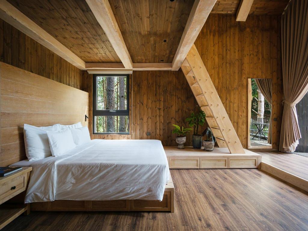 Postel nebo postele na pokoji v ubytování Mơ Stay - Forest Resort