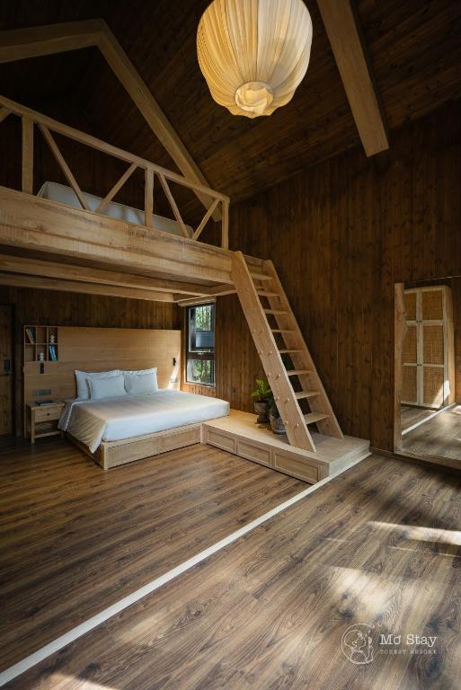 Giường trong phòng chung tại Mơ Stay - Forest Resort