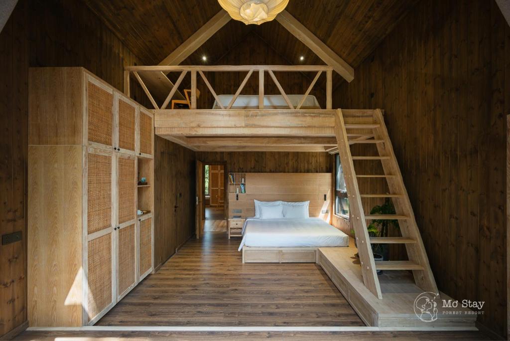 Postel nebo postele na pokoji v ubytování Mơ Stay - Forest Resort