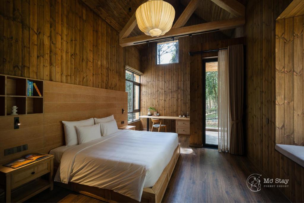 Postel nebo postele na pokoji v ubytování Mơ Stay - Forest Resort