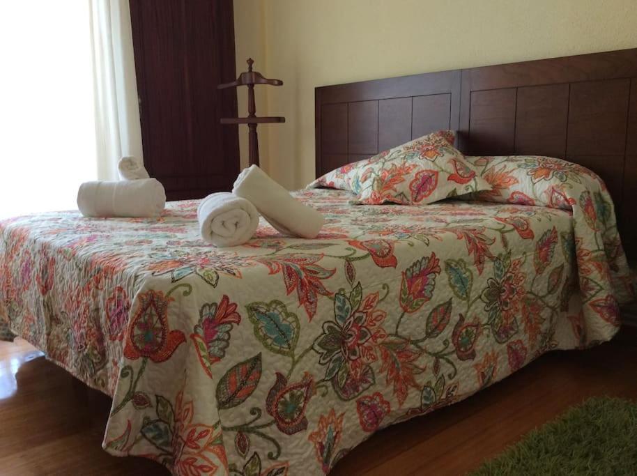 A bed or beds in a room at Apartamento en la Playa de Somo.
