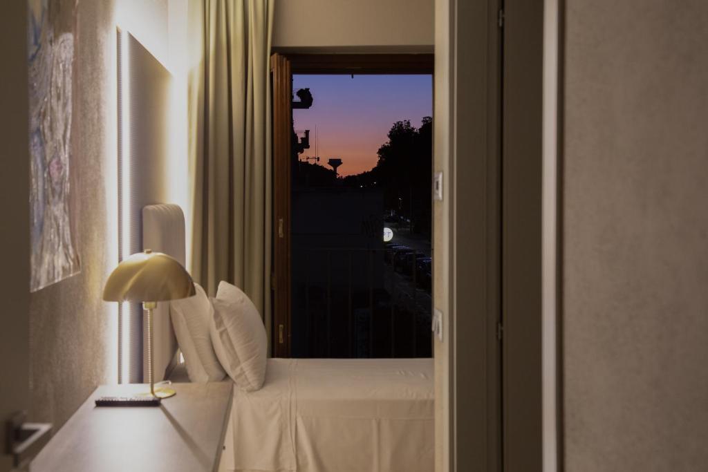 Postel nebo postele na pokoji v ubytování Hotel Battisti 31