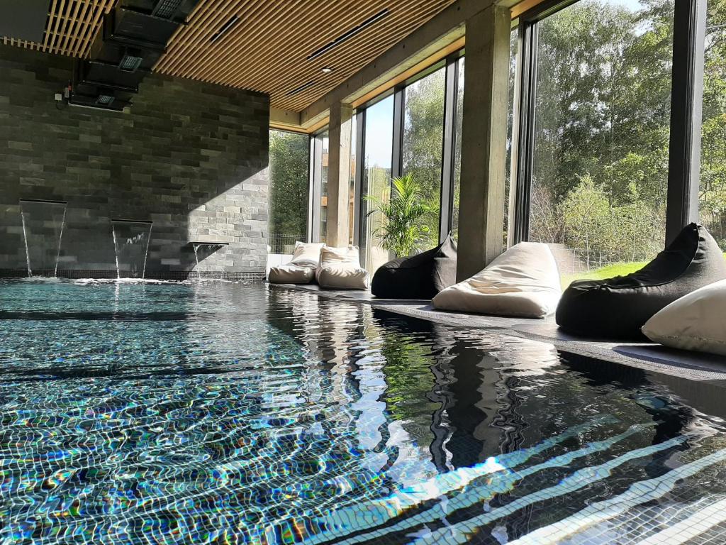 a pool in a house with a swimming pool at XYZ eXtreme You Zen in Szczyrk