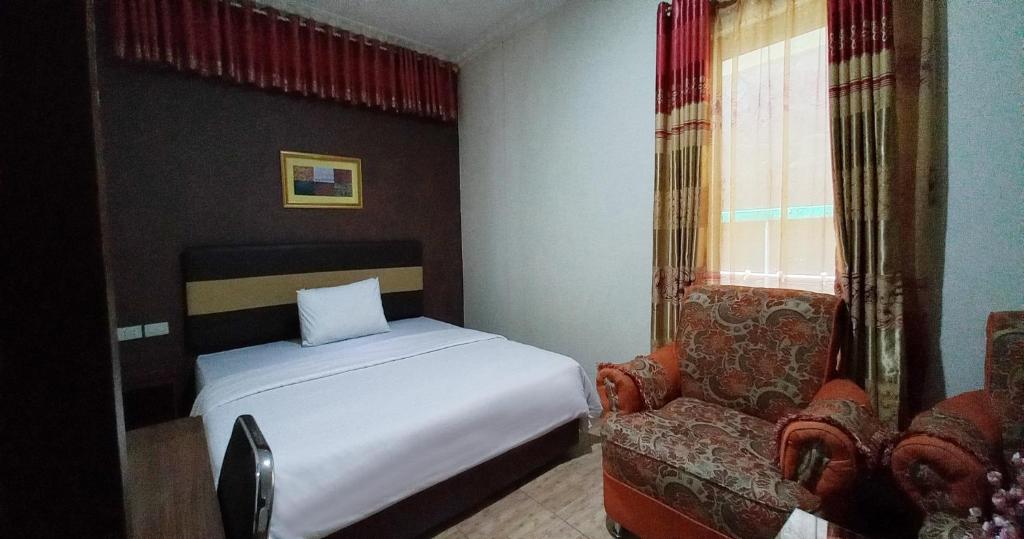 Postel nebo postele na pokoji v ubytování Hotel Syariah GS HERITAGE, Kota Metro