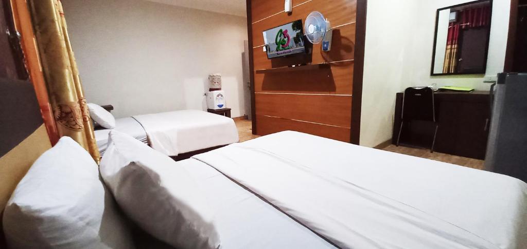 Postel nebo postele na pokoji v ubytování Hotel Syariah GS HERITAGE, Kota Metro