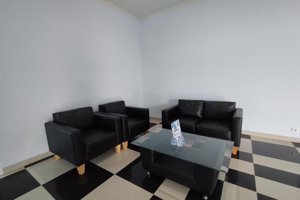 Posezení v ubytování Hotel Sutha Inn Syariah