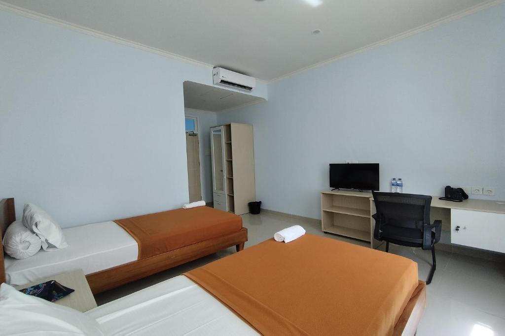 TV a/nebo společenská místnost v ubytování Hotel Sutha Inn Syariah