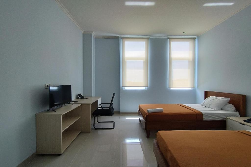 TV a/nebo společenská místnost v ubytování Hotel Sutha Inn Syariah