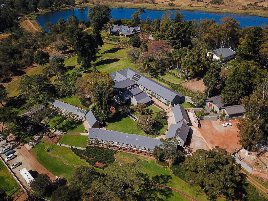 an overhead view of a large house with a yard at The Peech Boutique Hotel Zimbabwe in Kingsmead