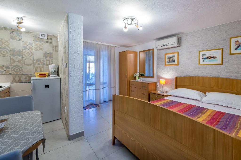 Postel nebo postele na pokoji v ubytování Apartments Nadica
