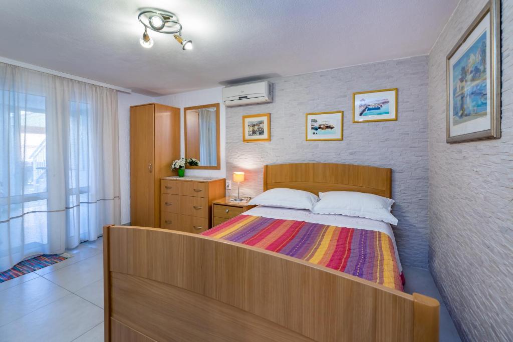 Postel nebo postele na pokoji v ubytování Apartments Nadica