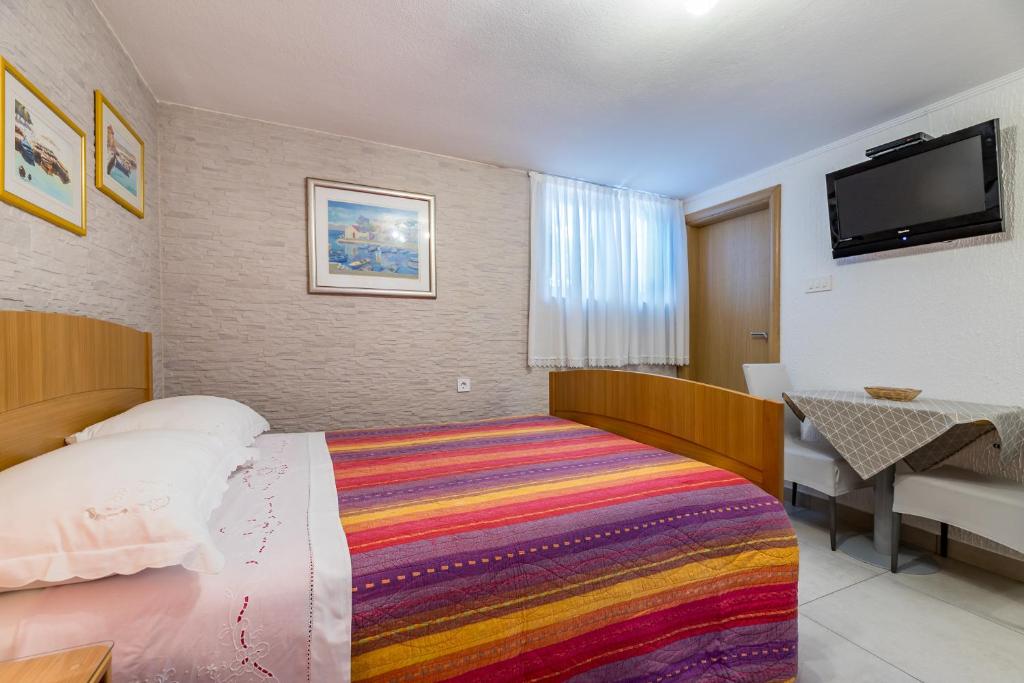 Postel nebo postele na pokoji v ubytování Apartments Nadica
