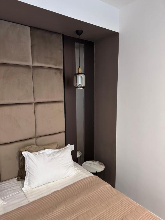 Postel nebo postele na pokoji v ubytování Garden Lounge Hotel