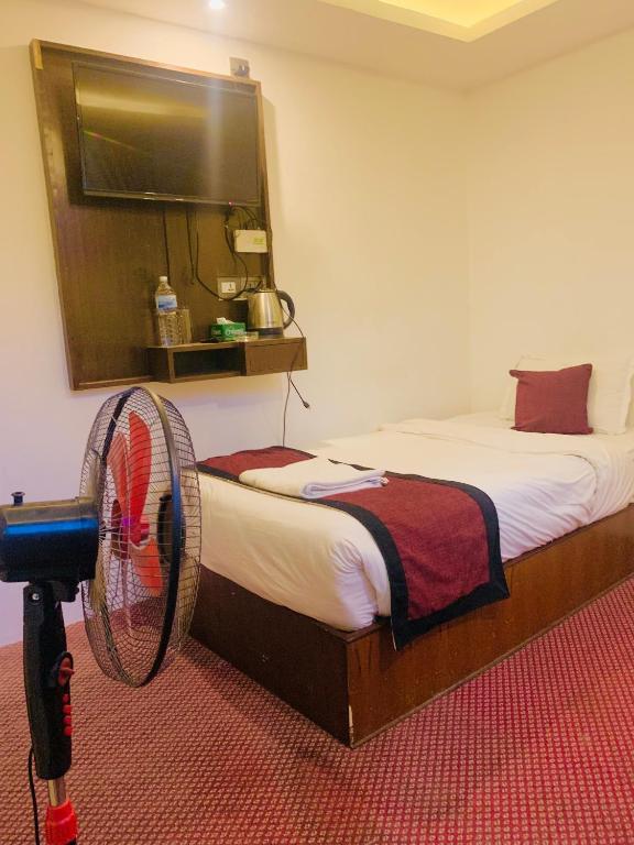 Postel nebo postele na pokoji v ubytování Hotel de Universal