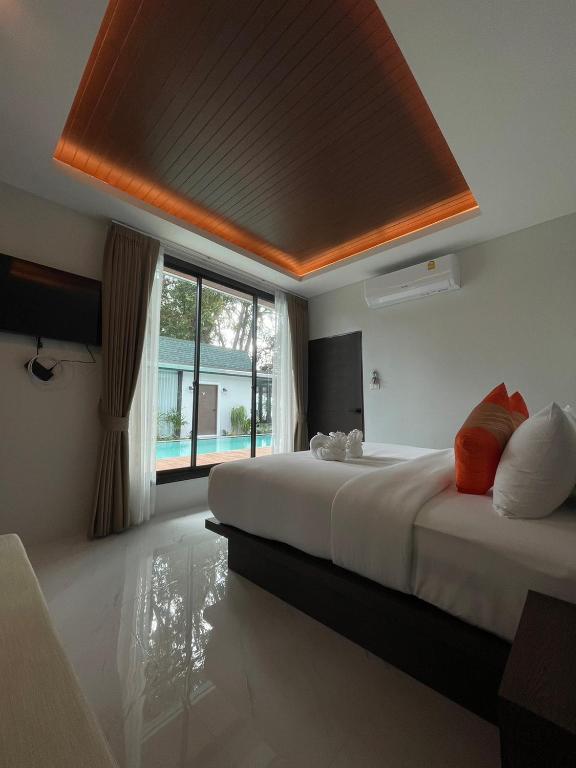 Postel nebo postele na pokoji v ubytování BeachHouse Pool Villas Krabi