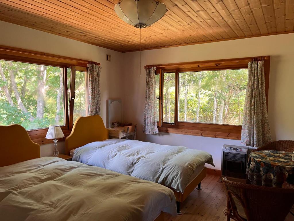 Tempat tidur dalam kamar di Ohisama House