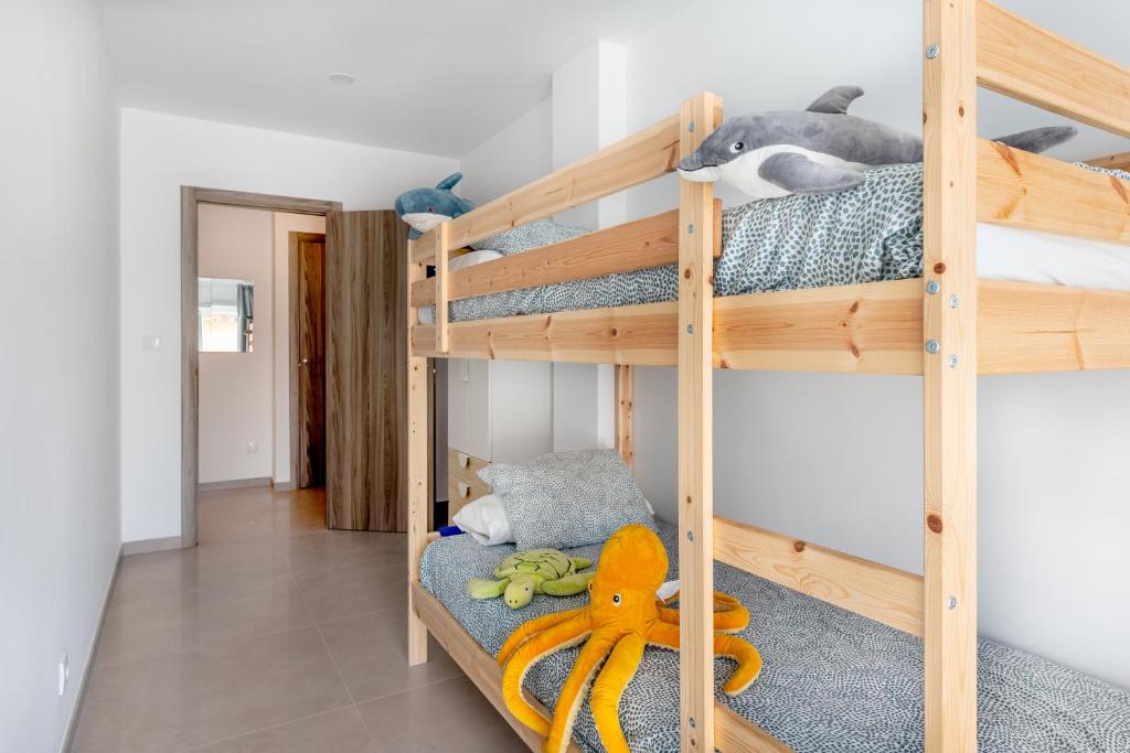 a bunk bed room with two bunk beds at Vilamercat in Sueca