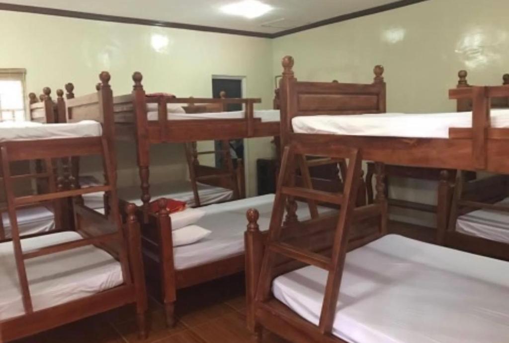 a group of bunk beds in a room at Relova’s Orchard Place in Victoria