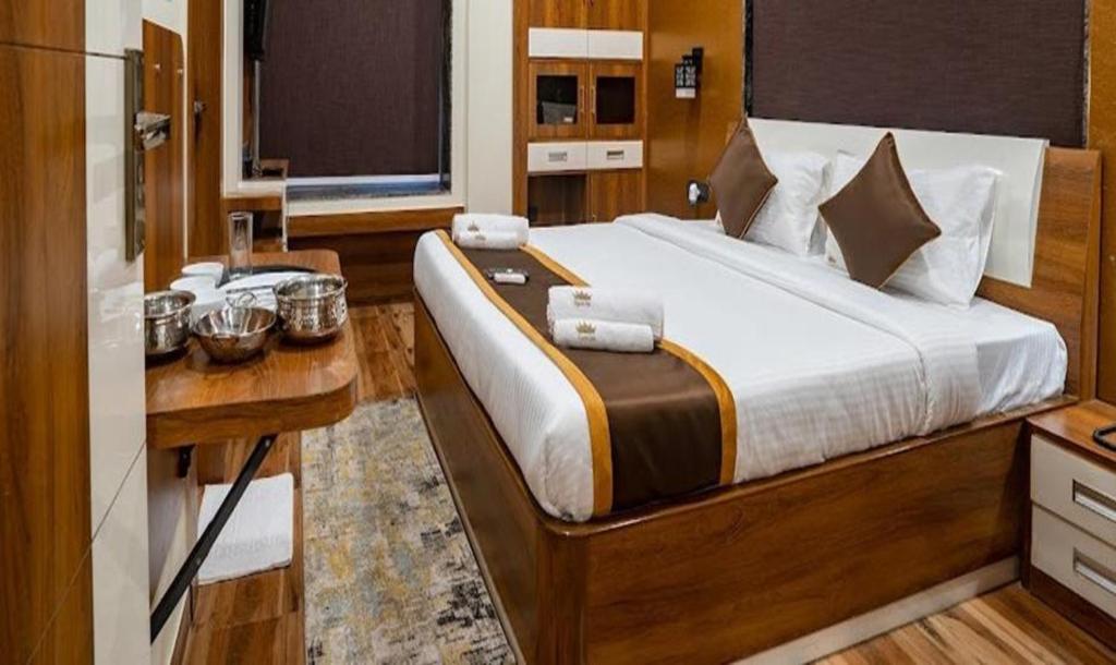 Postel nebo postele na pokoji v ubytování FabHotel Prime Tiyara Inn