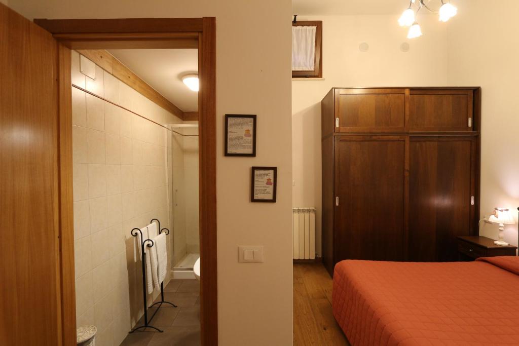 Łóżko lub łóżka w pokoju w obiekcie La Casina Colorata