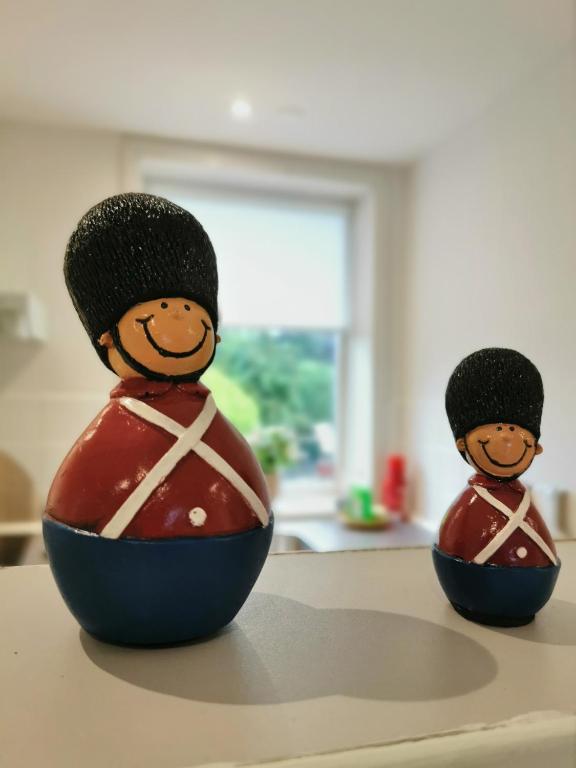 two wooden figurines sitting on top of a table at Håstrups Natur Perle in Faaborg