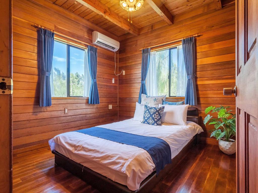 Postel nebo postele na pokoji v ubytování Kariyushi Condominium Resort Yuudekiya