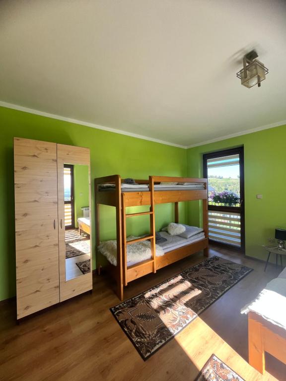 Postel nebo postele na pokoji v ubytování Pokoje Widok Szlembark