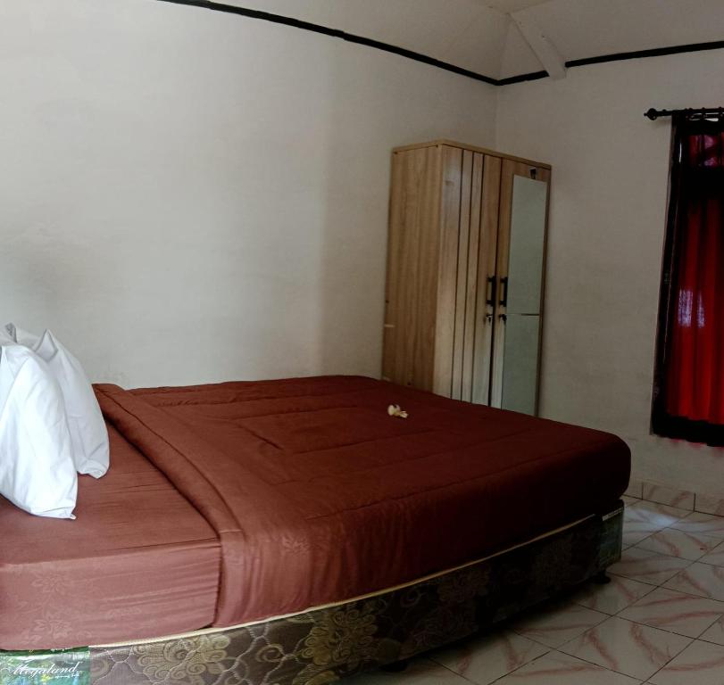 Postel nebo postele na pokoji v ubytování Wikan House