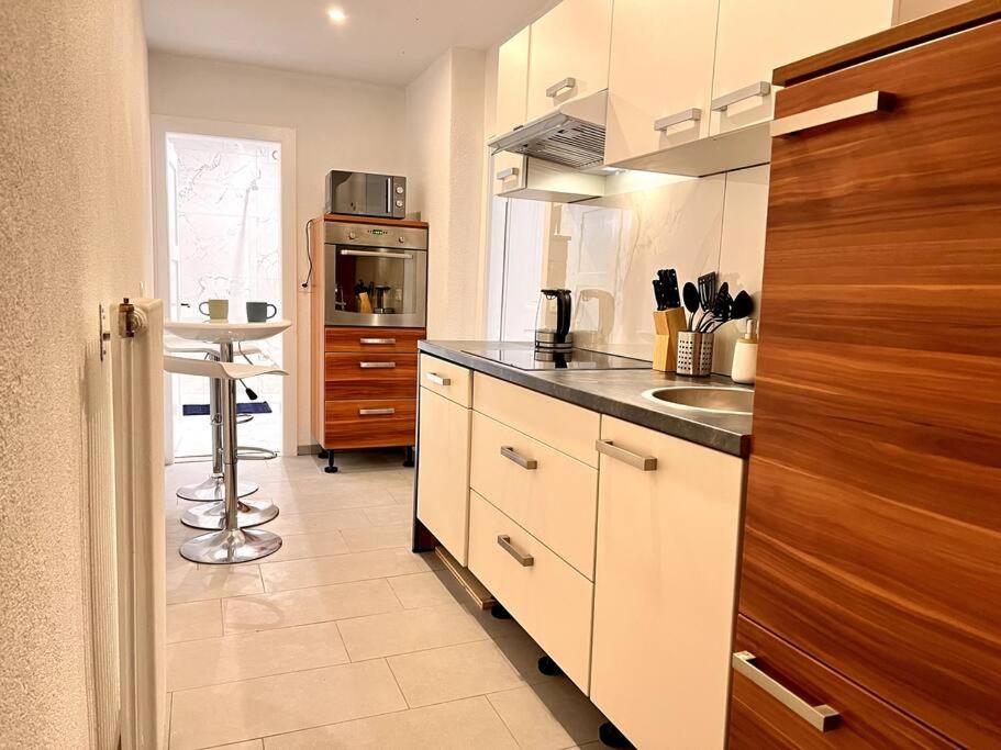 a kitchen with a sink and a counter top at Wesley House in Kandersteg