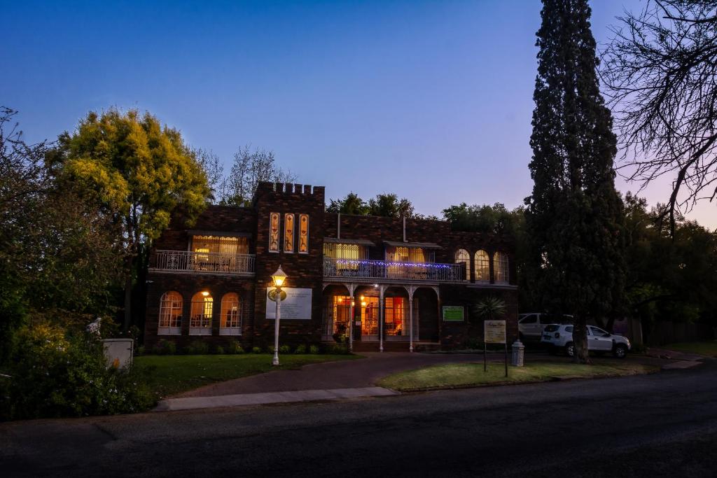 a house with lights on the front of it at Mistique Waters Guesthouse in Parys