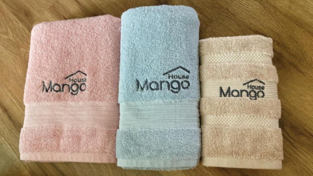 three towels with the name mongoro on them at Mango House-PanoramaSeaView I Biggest unit I Wifi I WaterFilter I Latex I Gym-JQ in Kota Kinabalu