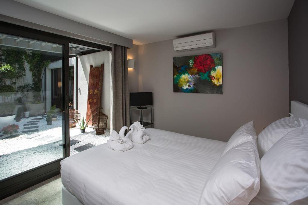 Postel nebo postele na pokoji v ubytování Be Loft B&B Pool & Spa