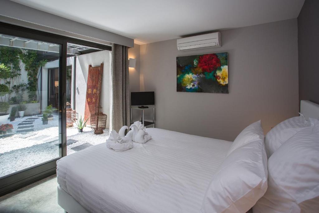 Postel nebo postele na pokoji v ubytování Be Loft B&B Pool & Spa