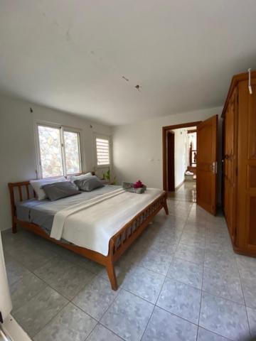 Postel nebo postele na pokoji v ubytování Grand Case Palace