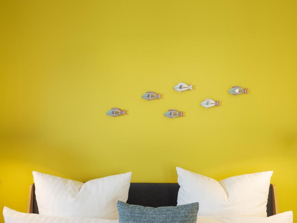 Postel nebo postele na pokoji v ubytování OSTKÜSTE - Villa Steigel Design Apartments